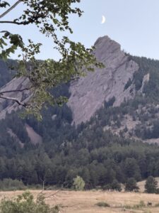 A brownish red mountain in the distance.