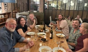 A group of people sitting at a table.