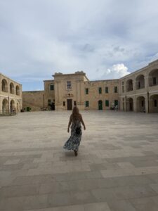 Quantz walking in a courtyard.