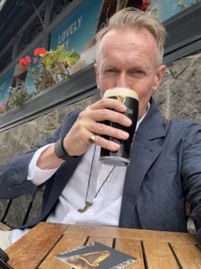 Karl sipping a glass of Guinness beer in Ireland.