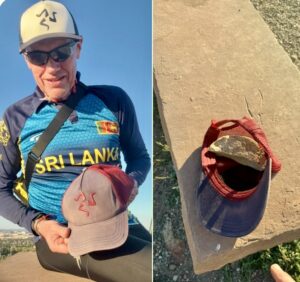 Karl holding his old baseball cap.