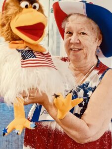 Marlene and her puppet Chris P. Chicken.